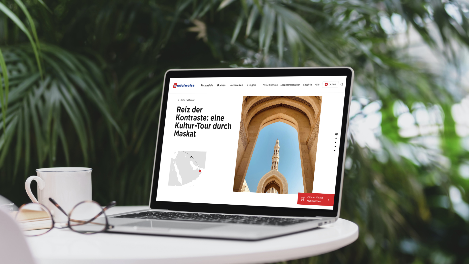 Laptop on a small table with trees in the background displaying the Edelweiss website.