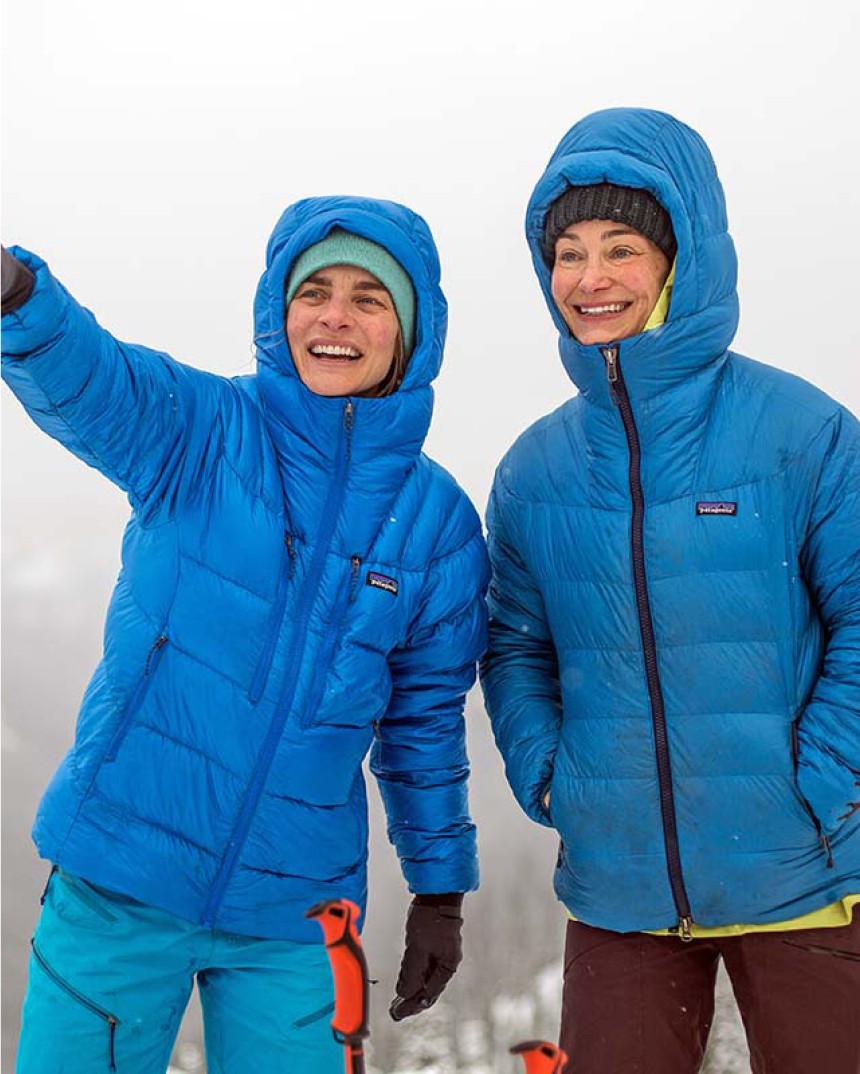 Two people in blue Patagonia jackets smiling