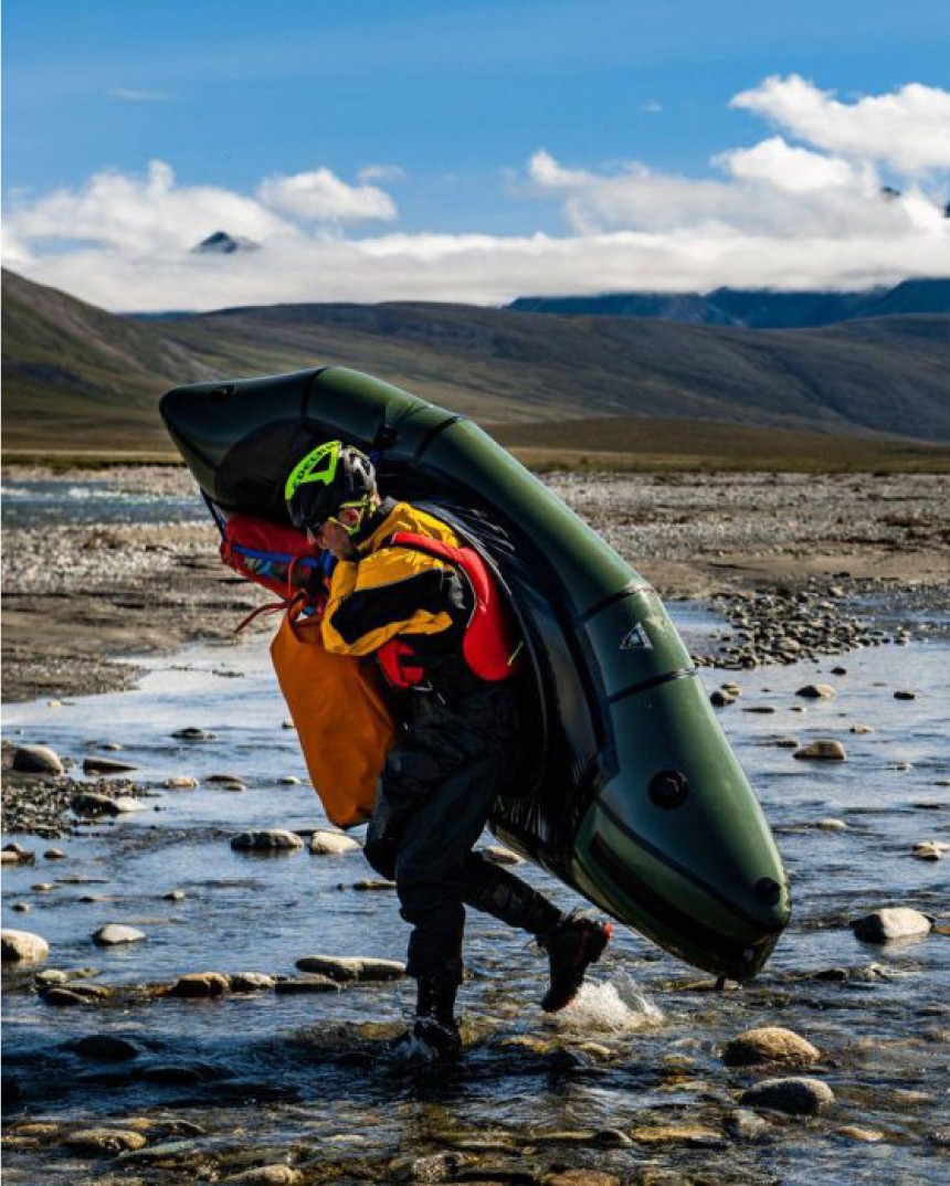 person carrying kayak