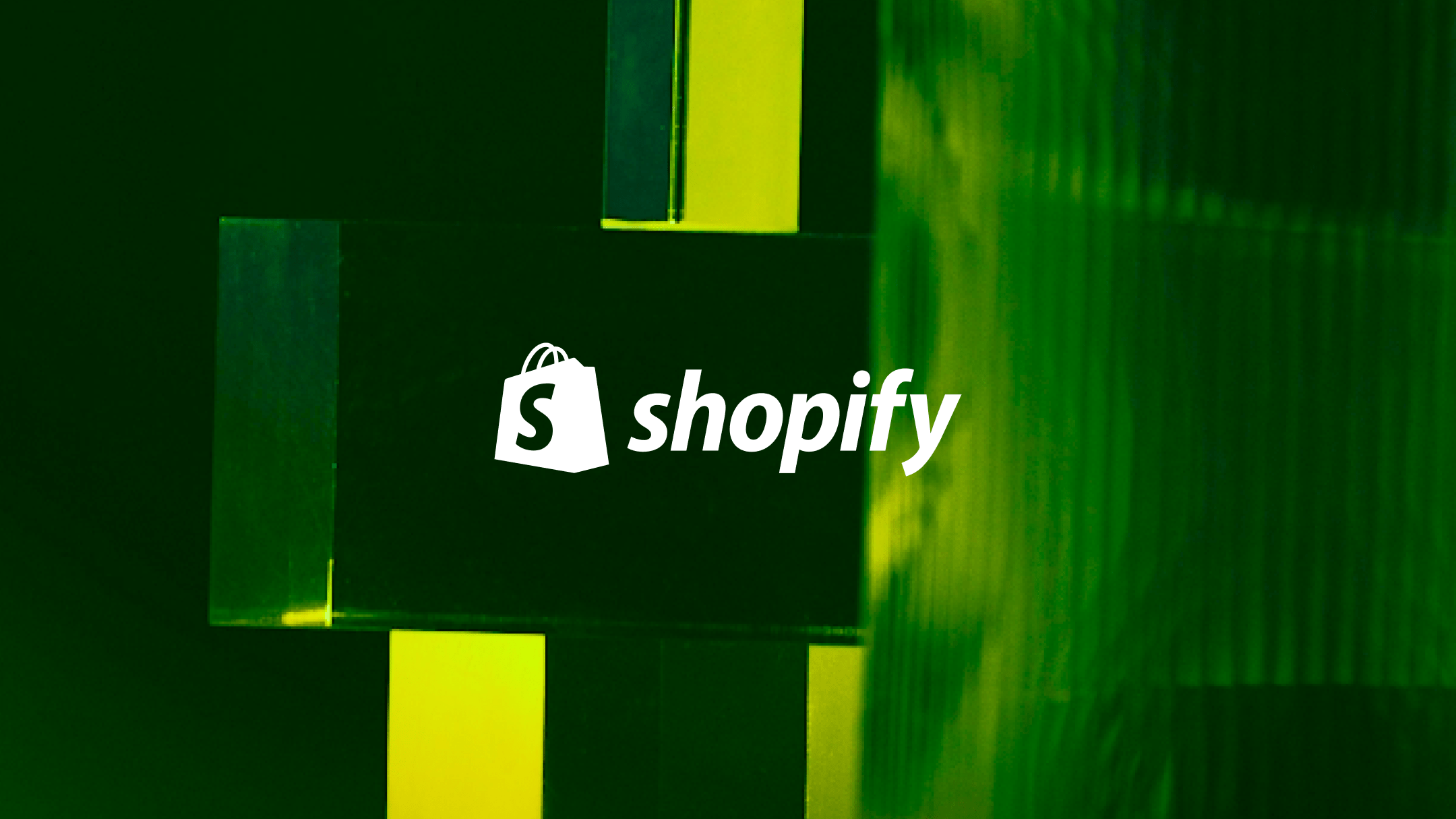 White shopify logo on a green background.